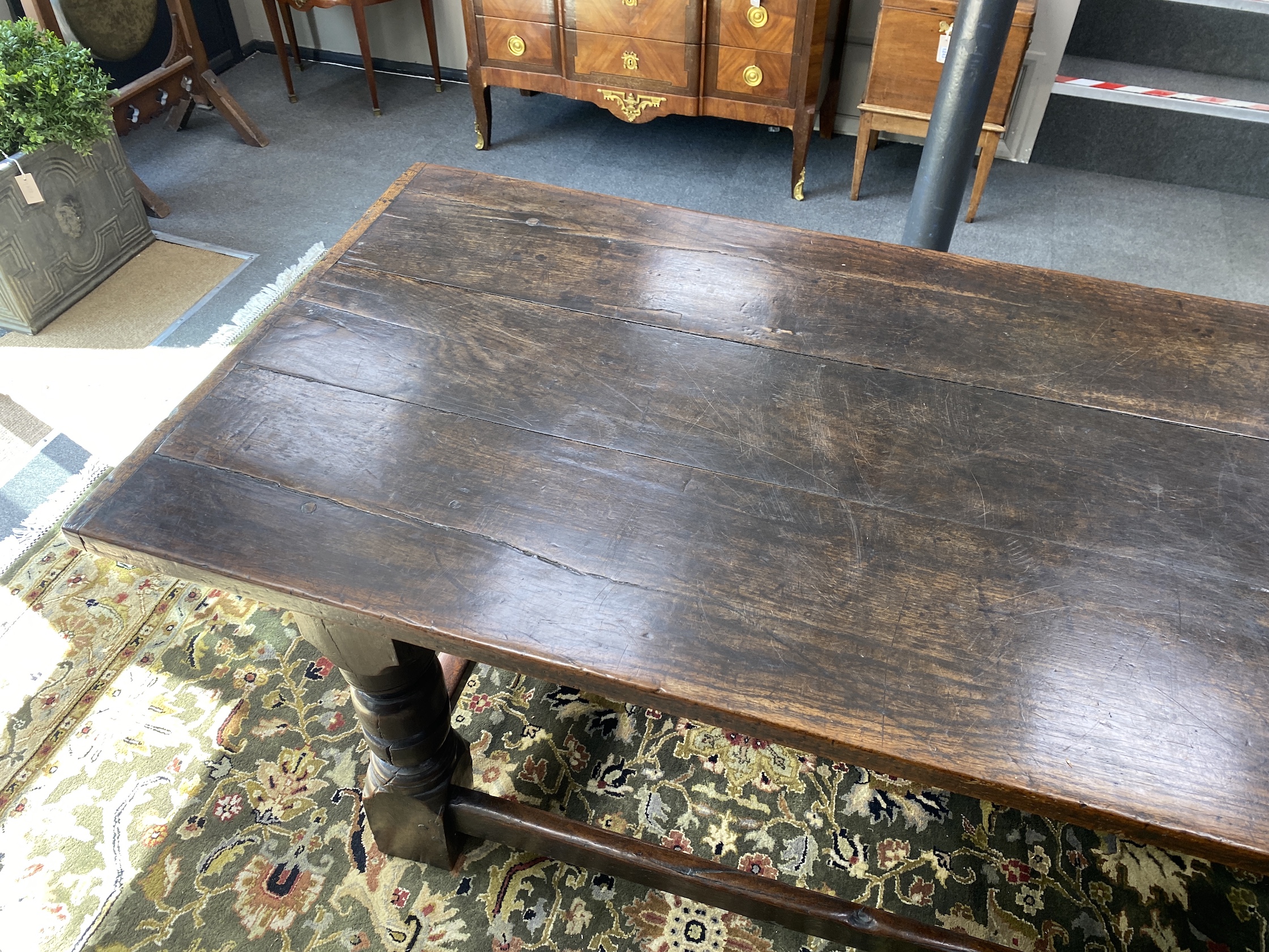 An 18th century and later rectangular oak refectory dining table, length 194cm, width 83cm, height 79cm and two Derbyshire style oak chairs